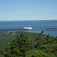 The cruise ship is bigger than many islands outside the harbor.